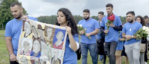 young people with memorial banner 