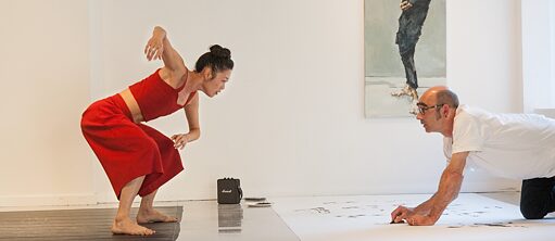 Artist draws dancer in performance