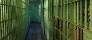 Bed in a prison cell.