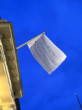 The flag hanging outside the Goethe-Institut London with blue sky 