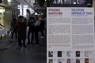 September 2019, Poster-Ausstellung „The Future Heritage of Today” im Einkaufszentrum „Galerija Centrs”. Die ausgestellten Werke enstanden anlässlich des 100-jährigen Jubiläums der Republik Lettland und gingen der folgenden Frage nach: „ Welches kulturelle Erbe werden zukünftige Generationen übernehmen?”.