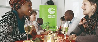 Two enthusiastic ladies enjoying a speak-dating event at Goethe-Institut Johannesburg. 