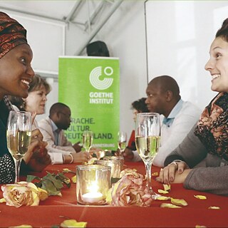Two enthusiastic ladies enjoying a speak-dating event at Goethe-Institut Johannesburg. 