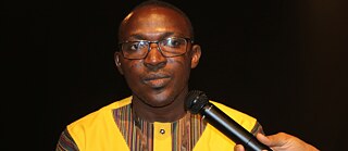 Le Marchand. Der Kaufmann. Lêêbda. - Thierry OUEDA 