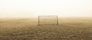 soccer goal on foggy soccer field
