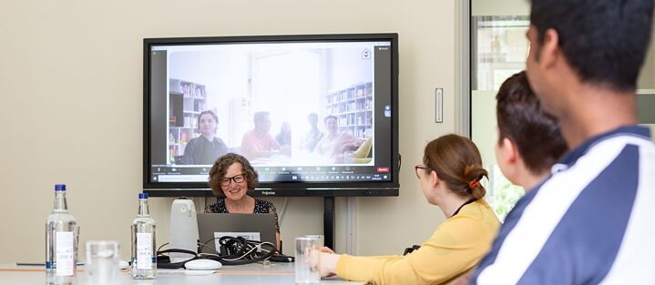 people discussing seated at a table
