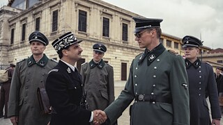 SS Gruppenführer Schrader (Markus Gertken) meets Vichy officials. Production Still from the Netflix Series Transatlantic