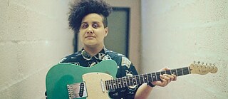 Ray Aggs with guitar