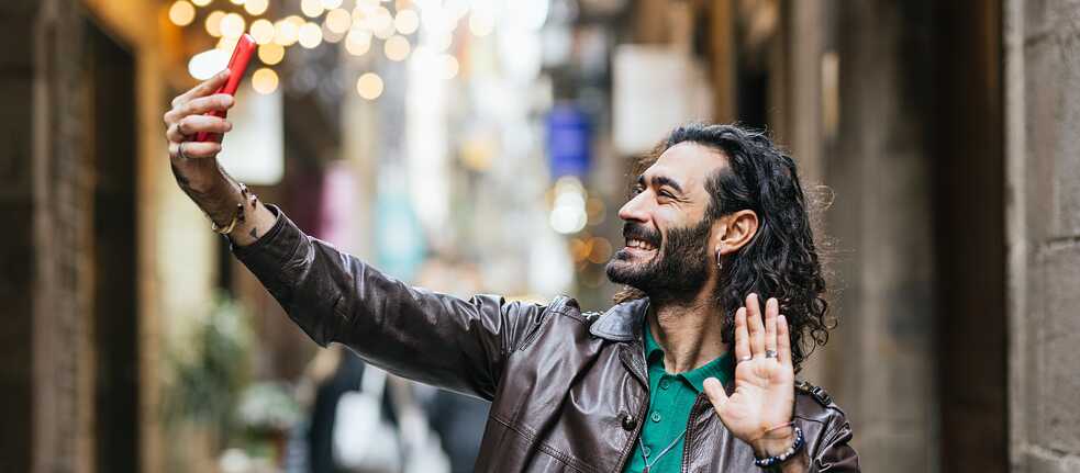 Man taking a selfie in the city