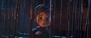 Ein kleiner Junge schaut ängstlich durch Gitterstäbe hindurch. &copy; (c) Aurélien Pira, ZEILT productions L'Ogre, Regie: Aurélien Pira