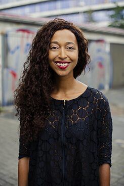 Melanie Raabe, smiling, portrait blurry background