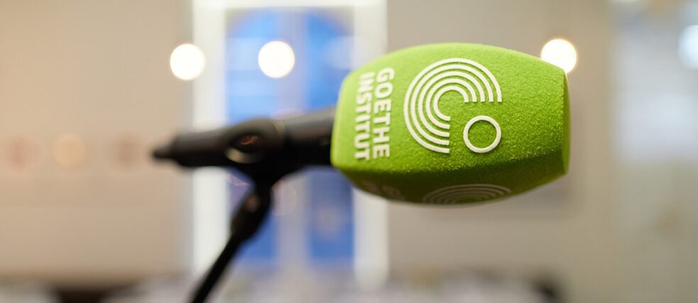 Close-up of a microphone with the logo of the Goethe-Institut.