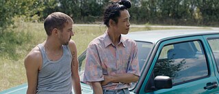 Markus in front of a car