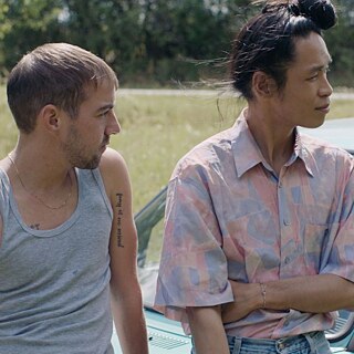 Markus in front of a car