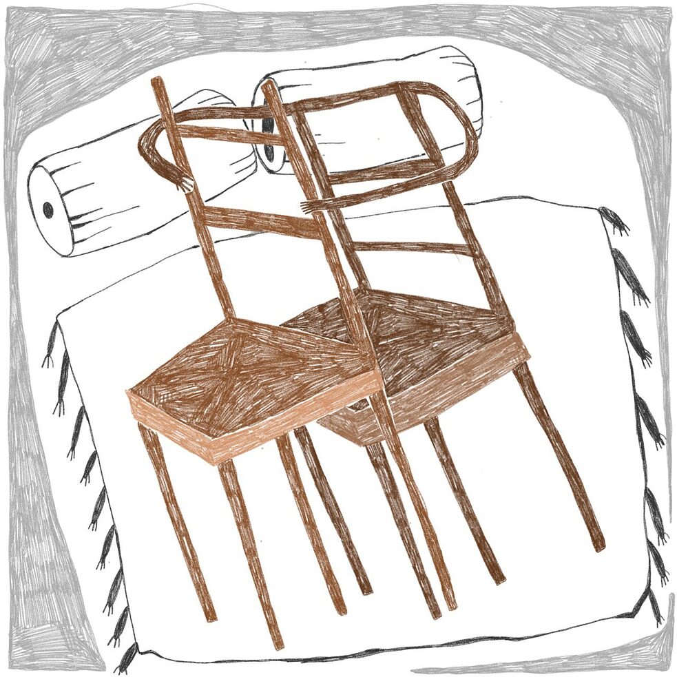 Two chairs lying close together in bed