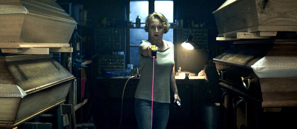  Blum (Anna Maria Mühe) confronts an intruder at the funeral home.