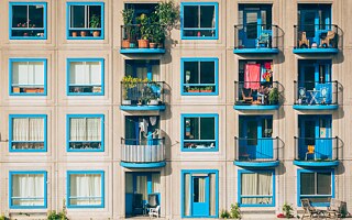 White and blue concrete 4-storey building