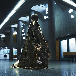 Naila Schuberth as Hannah wandering the hospital hallways. Stillframe from the Netflix Germany series "Liebes Kind / Dear Child"