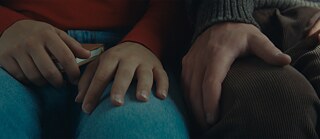 Aurélia Arandi-Longpré, Noah Parker (or, rather their hands) in "Who by Fire" by Philippe Lesagee