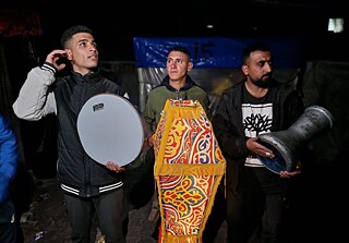 The trio of Youssed Abu Hameed, Motassem and Mohamed volunteered to perform the role of mesaharaty, an age-old tradition of males roaming the streets before dawn to wake up observers of Ramadan to have their sunrise meals. The three young men believe its the least they can do to engage the distressed children of Gaza when they call out for suhour in the displacement camps.