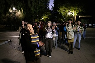 Two dancers, Lamia and Wang Yunke, led a group of twenty people to form a team with a shared secret of music only they could hear, live DJ-ed by Rydeem Wong.