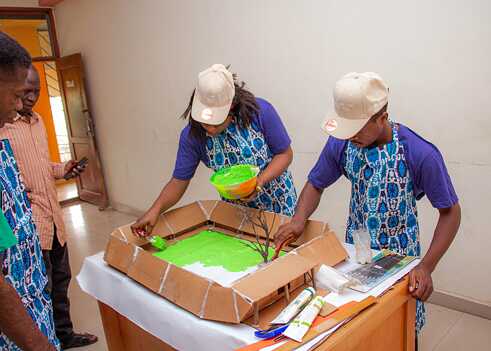 COD Fellows painting a Museum prototype