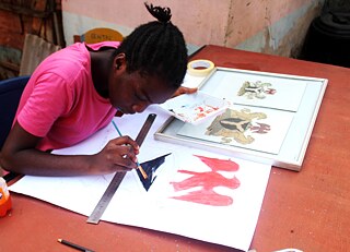 Girl focused on her painting