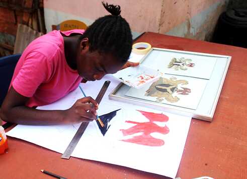 Girl focused on her painting