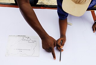 COD and Youth looking over drawing