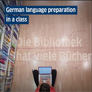  close-up view of an open dictionary, with text and definitions filling both pages, creating a dense and detailed visual of printed words.