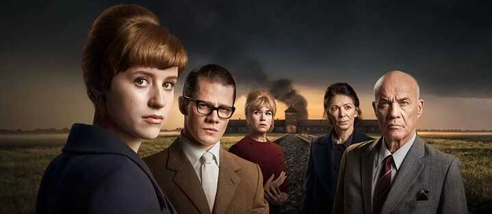 Key art from the Disney+ original series 'Deutsches Haus' shows the protagonists of the series against the silhouette of a concentration camp.