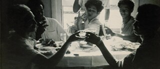 Christmas lunch in Rutger Street (L-R seated) Kewpie; Carmen; Hayley Mills; Mitzi; Brigitte. Unknown person at the back, possibly Miss Caron. Date unknown. Photographer unknown. Kewpie Collection. GALA Queer Archive
