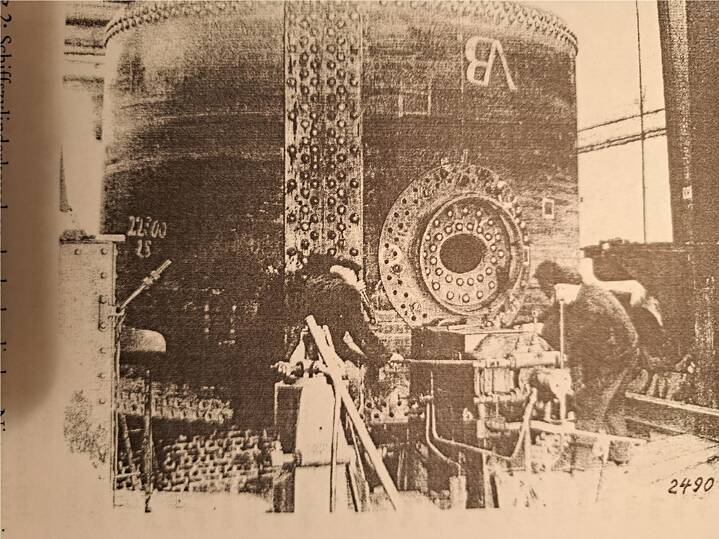 Ship’s cylinder boiler at the riveting press, in the centre the manhole through which the Kedelkloppers entered the boiler. Ottenser Eisenwerke, circa 1930