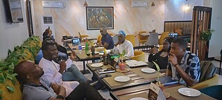 The Book Club Lagos members holding up My transition hours