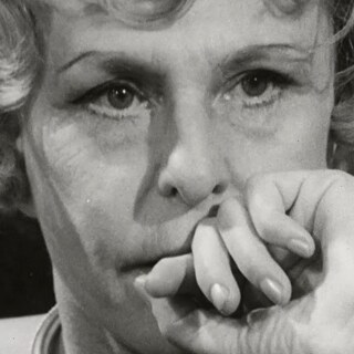 Black and white close up of an old woman