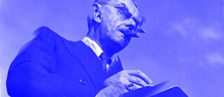 black and white photo of Thomas Mann with a blue filter added