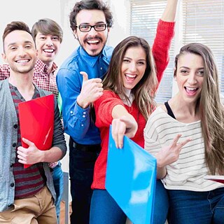 Several people laugh into the camera.