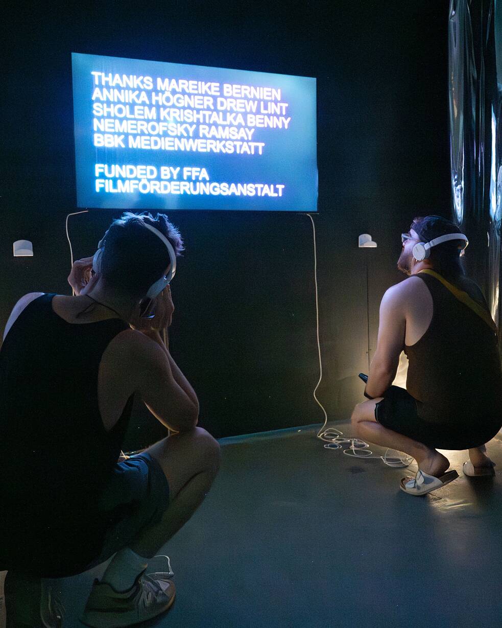 Two people at the Berlin Underground exhibition in Washington, DC