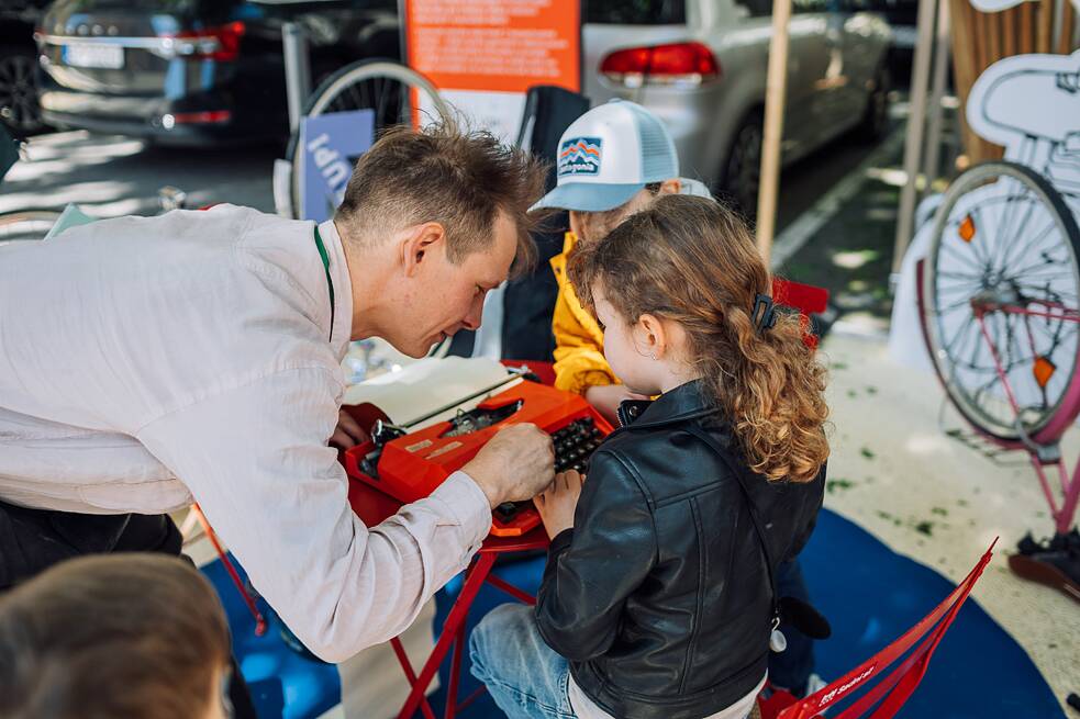 Artist with a girl at a type writer