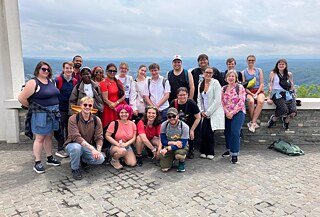 Group photo of the Summer Academy and leadership at the top of the Drachenfels