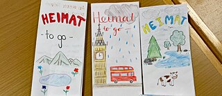 Unsere Jugendlichen malen bunte Broschüren zu ihrer Heimat.