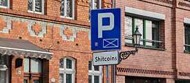 Shitcoin-Schild in Toruń, Polen