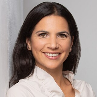 A photo of Jamila in a white shirt