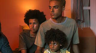  The inner child: Lalo (Lamin Leroy Gibba, centre) feels close to his 15-year-old (Addis Amadou, left) and 8-year-old selves (Joel Ngari, right) when he watches videos from his childhood.