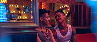 Lalo (Lamin Leroy Gibba) and Joshua (Daniel Hernandez) looking at each other