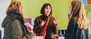 Teacher explains something to language students