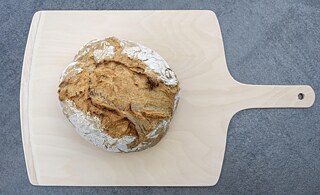 A farmer's bread on a wooden board.
