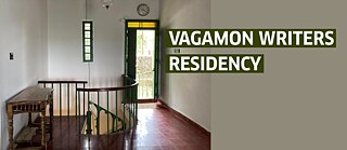 text on the backdrop of a traditional Kerala house 