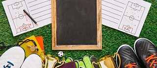 A symbolic image for teaching materials, featuring soccer shoes and a sketch of a field
