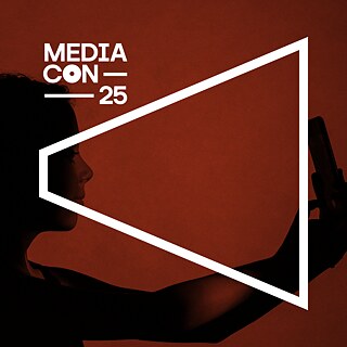 Person taking a selfie with a smartphone, in a reddish tone, symbolizing the importance of fact-checking